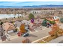 Aerial view showing home's location near a lake and mountains at 813 Wade Rd, Longmont, CO 80503