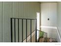 Indoor view of a staircase with a simple, modern railing at 8756 Chase Dr # 79, Arvada, CO 80003