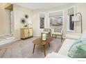 Bright living room with bay window and comfy seating at 1486 Clover Creek Dr, Longmont, CO 80503