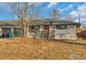 Ranch home with updated exterior, landscaping, and a modern door at 4670 Independence N St, Wheat Ridge, CO 80033