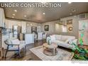 Open concept living space with kitchen and dining area at 410 High Point Dr # 105, Longmont, CO 80504