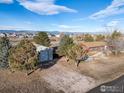 Aerial view showing a ranch home, detached workshop, and expansive landscape at 4627 Anne Pl, Erie, CO 80516