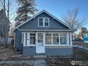 Gray house with a sun porch and detached garage at 841 N Bross St, Longmont, CO 80501