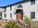 Front door of house with ornate wooden door, brick exterior, and decorative lighting at 1490 Saint Andrews Dr, Broomfield, CO 80020