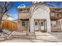 Front exterior view of a two-story condo building with a walkway leading to the entrance at 2049 Estes Ln # 4, Longmont, CO 80501