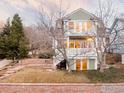 Inviting home exterior with a front balcony and stone retaining wall at 2205 Bluff St, Boulder, CO 80304