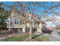 Two story townhome with a tree and patio in front at 3405 Valmont Rd # A, Boulder, CO 80301