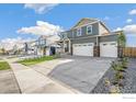 Attractive two-story home with a three-car garage and a welcoming front porch at 4205 Sandstone Dr, Mead, CO 80504