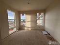 Spacious bedroom with large windows and bright natural light at 2277 Serenidad St, Brighton, CO 80601