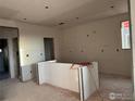 Kitchen with island and recessed lighting, awaiting finishes at 2283 Serenidad St, Brighton, CO 80601