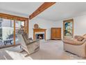 Bright living room with fireplace and access to backyard at 112 W Elm St, Louisville, CO 80027