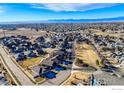 Aerial view of a residential neighborhood with houses and green spaces at 1435 Rustic Dr, Longmont, CO 80504