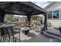 Deck with gazebo, fire pit, and seating area at 2292 Brantner Pl, Brighton, CO 80601