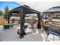 Deck with gazebo, grill, and comfortable seating at 2292 Brantner Pl, Brighton, CO 80601
