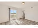 Bright bedroom with sliding door to balcony and view at 2848 South Flat Cir, Longmont, CO 80503