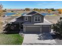 Two story house with a large yard and pond views at 16380 Umpire St, Hudson, CO 80642