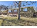 Brick ranch home with mature ivy covering a portion of the exterior at 1641 S Sheridan Blvd, Lakewood, CO 80232