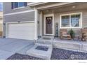 Inviting front entrance with rocking chairs and a welcoming mat at 2262 Monte Vista St, Fort Lupton, CO 80621
