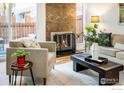 Cozy living room with a fireplace and comfortable seating at 2970 W 119Th Ave, Westminster, CO 80234