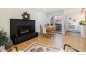 Cozy dining area featuring a fireplace and patio access at 3035 Oneal Pkwy # 21, Boulder, CO 80301