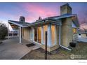 Mid-century modern home with a brick exterior and sliding glass doors at 34 S Raleigh St, Denver, CO 80219