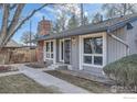 Gray house with a walkway leading to the entrance at 6495 E Happy Canyon Rd # 5, Denver, CO 80237