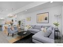 Open concept living room and kitchen with modern furniture at 440 Levi Ln # A, Lafayette, CO 80026