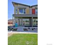 Modern two-story townhome with front porch and lawn at 440 Levi Ln # A, Lafayette, CO 80026