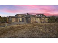 Stunning contemporary home with three-car garage and expansive windows at 11364 Birolli Pl, Littleton, CO 80125