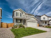 Two-story house with landscaped yard and attached garage at 27431 E 10Th Dr, Aurora, CO 80018