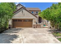 Two-story house with a large garage at 5021 Ballarat Ln, Castle Rock, CO 80108