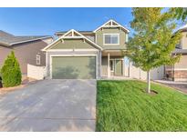 Two-story house with green accents and landscaping at 4572 Walden Way, Denver, CO 80249