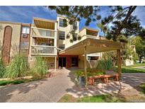 Attractive building exterior with landscaping and covered entryway at 1306 S Parker Rd # 164, Denver, CO 80231