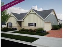 Charming two-story home with a landscaped yard and a two-car garage at 5176 N Quemoy Ct, Aurora, CO 80019