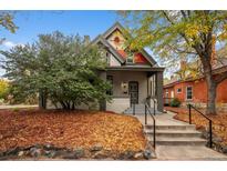 Charming two-story home with a landscaped yard and walkway at 1111 N Corona St, Denver, CO 80218