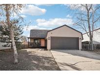 Updated Ranch style home with attached garage and covered porch at 9630 W 105Th Ave, Broomfield, CO 80021