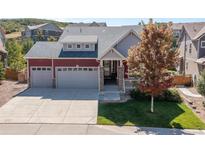 Beautiful two-story home with a spacious driveway and landscaping at 1178 Freedom Way, Castle Rock, CO 80109