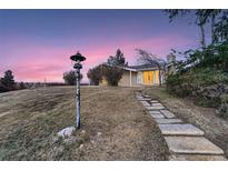 Ranch style home with stone pathway, offering curb appeal at 34 S Raleigh St, Denver, CO 80219