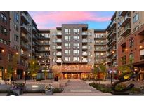 Modern apartment building with courtyard and string lights at 20 Wilcox St # 216, Castle Rock, CO 80104