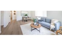 Bright living room with modern furniture and hardwood floors at 177 Wolff St, Denver, CO 80219