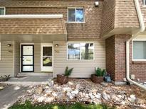 Neatly landscaped exterior of a townhome with double doors at 5670 S Lowell Blvd, Littleton, CO 80123