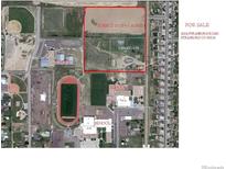 Aerial view of 13.35 acres of land near schools at 2024 Strasburg Rd, Strasburg, CO 80136