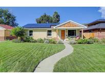 Charming ranch home with solar panels and landscaped yard at 3339 S Ogden St, Englewood, CO 80113