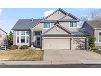 Two-story house with attached garage and landscaping at 22333 Quail Run Way, Parker, CO 80138