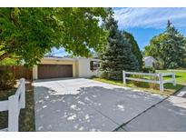 House exterior featuring a brown door and driveway at 2502 Beech Ct, Golden, CO 80401