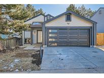 Updated craftsman style home with two-car garage and front landscaping at 17826 E Ada Dr, Aurora, CO 80017