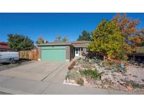 Brick ranch home with landscaped yard at 4963 Billings St, Denver, CO 80239