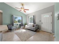 Living room with vaulted ceiling, and comfy seating at 2137 S Vallejo St, Englewood, CO 80110