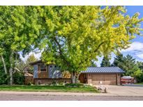 Charming ranch home with mature landscaping at 6039 W Fair Dr, Littleton, CO 80123