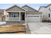 New construction home with attached two-car garage and front porch at 684 Penn Rd, Elizabeth, CO 80107